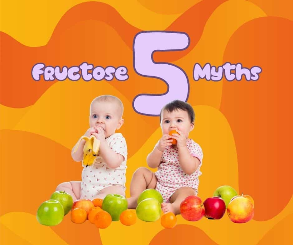 two babies eating fruit